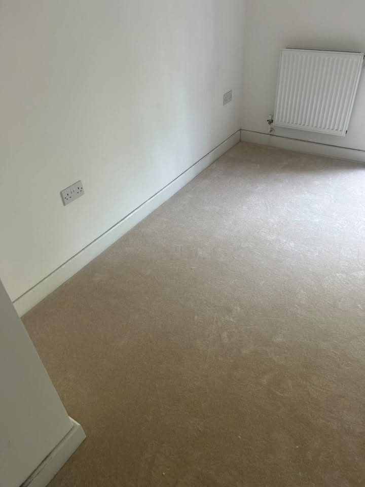 Cream carpet fitted in an empty bedroom
