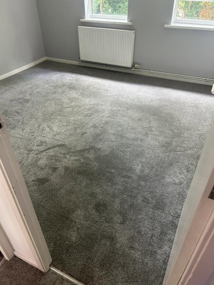 Soft grey carpet fitted in a bedroom