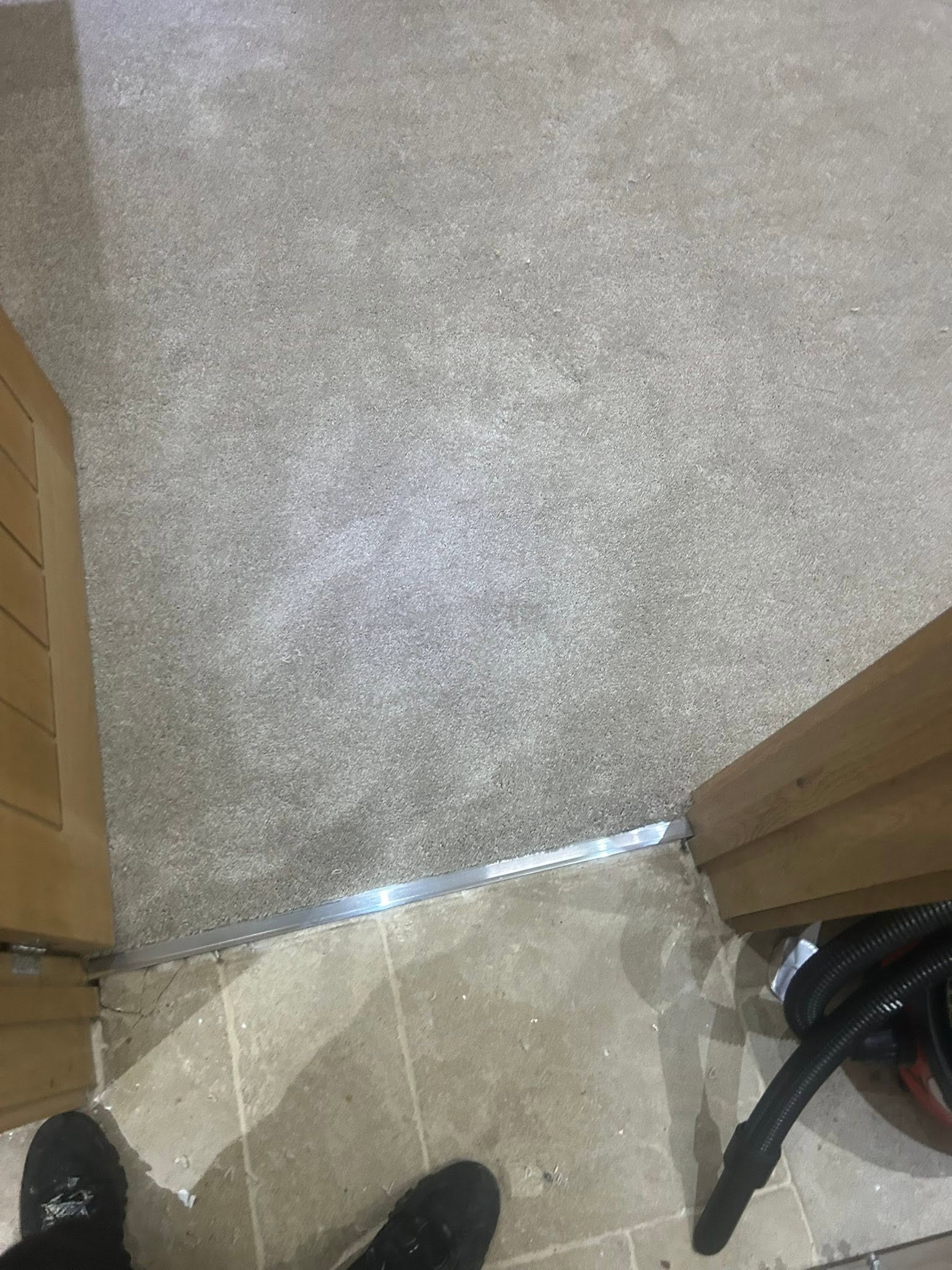 Carpet meeting tile flooring with a neat transition strip